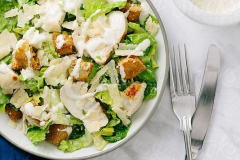 Classic-Chicken-Caesar-Salad-on-plate-from-above…
